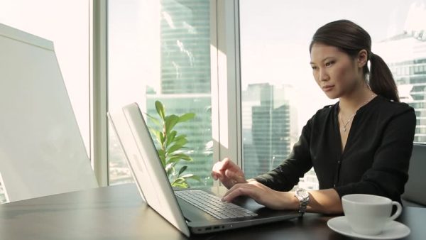 a businesswoman working on her laptop