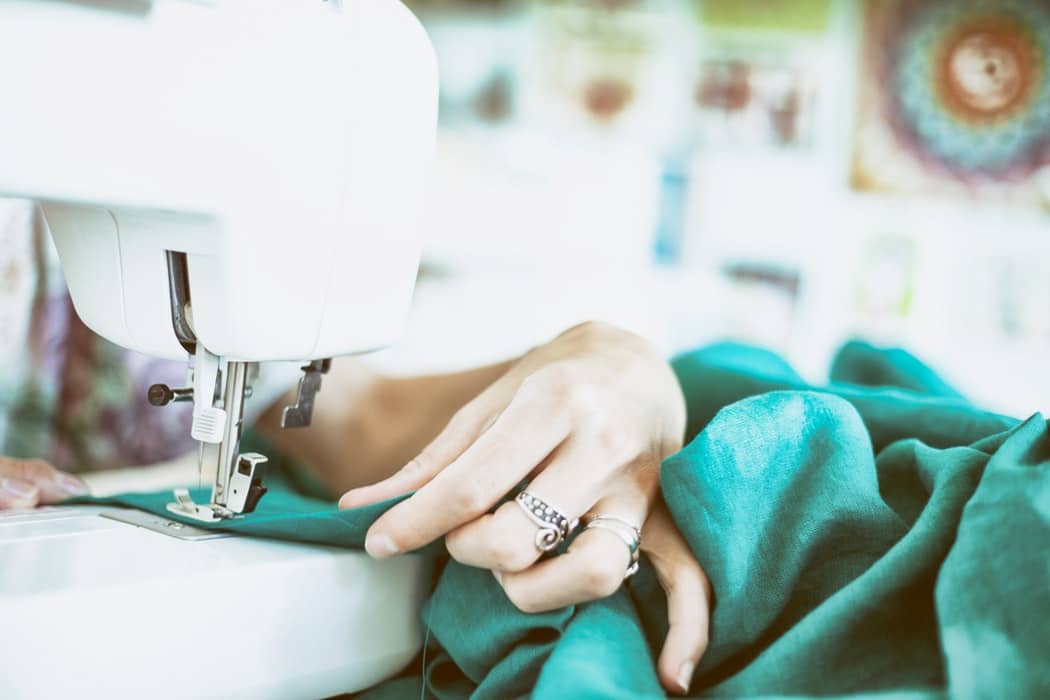 woman sewing at desk