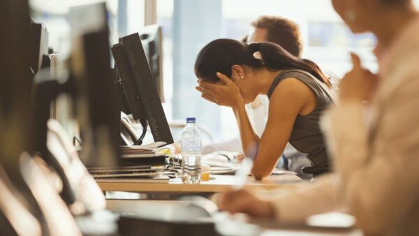A woman who is stressed out at work