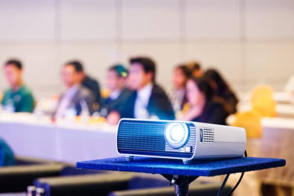colleagues in a meeting room watching the projection