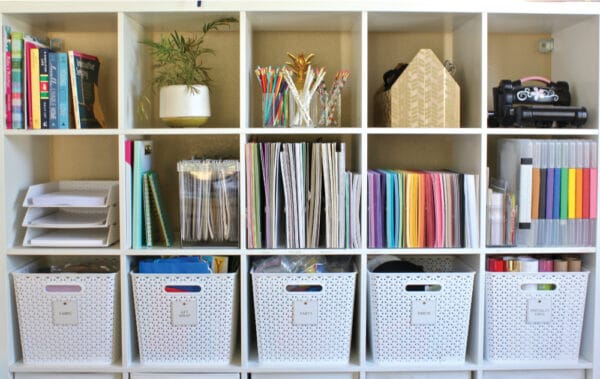 a shelf keeping office items organised
