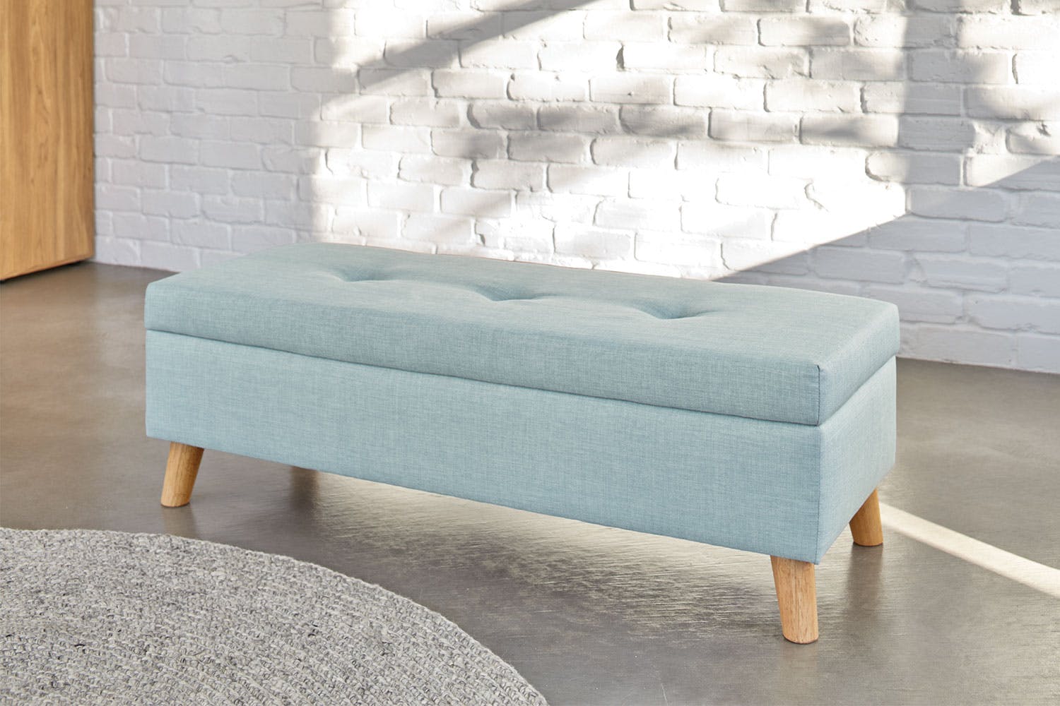 blue storage ottoman 