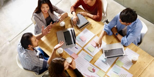 A group of people co-working alongside each other