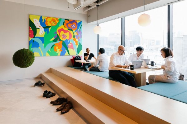 professionals working in a spacious and bright co-working space