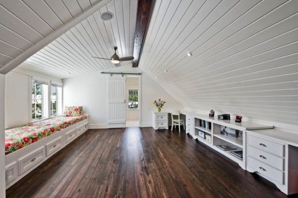 an attic with dark wooden flooring