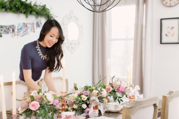 an asian wedding planning arranging the table