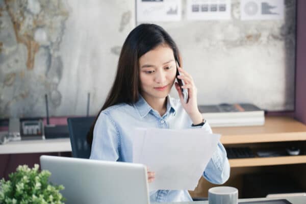 an asian businesswoman reading