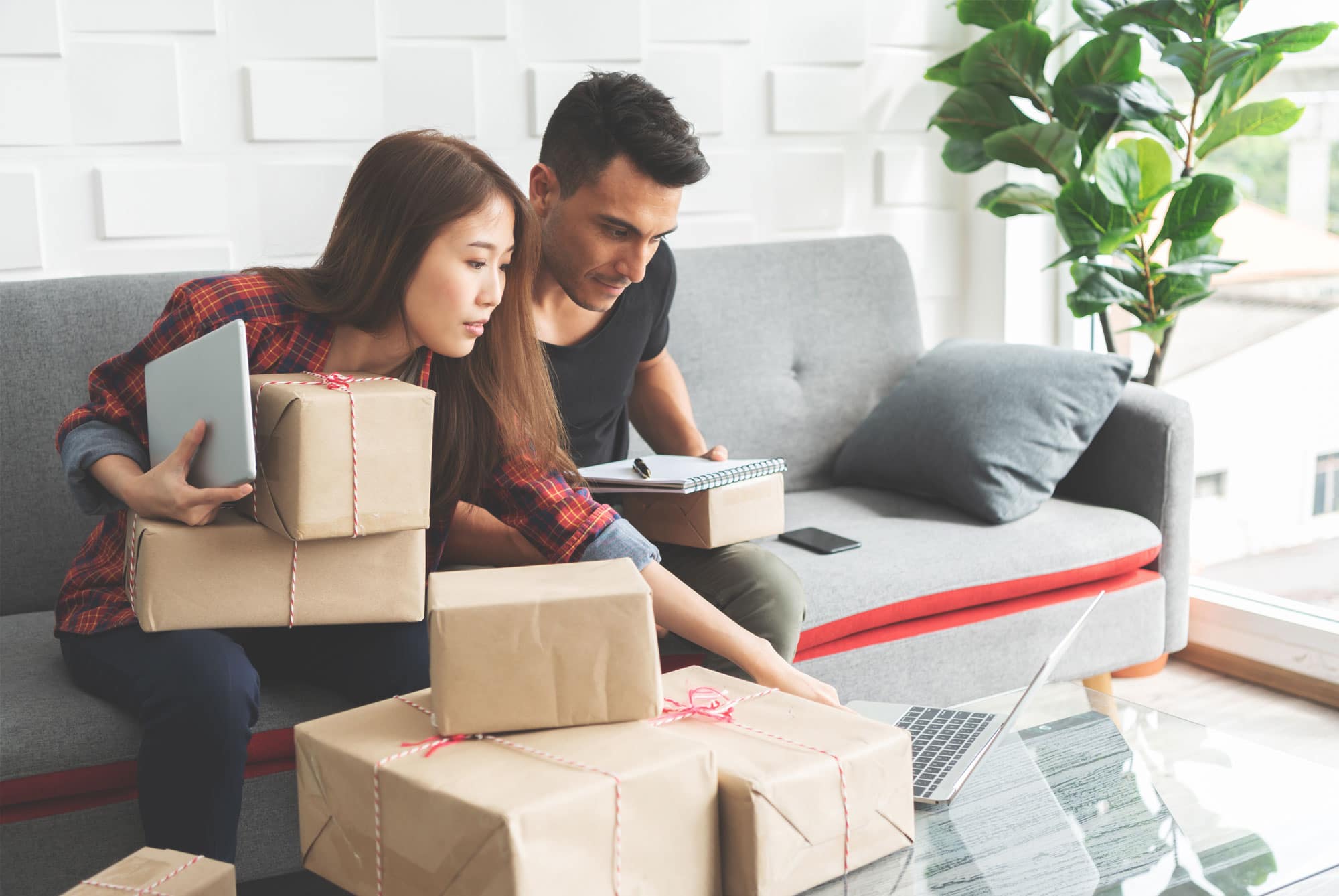 couple on couch with parcels