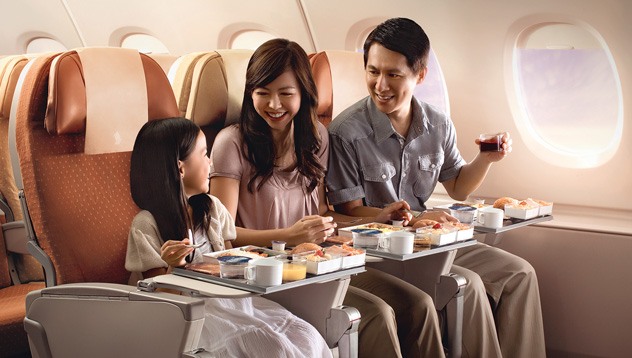 Family flying in airplane