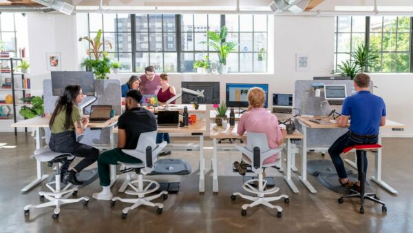 a group of people working in an office