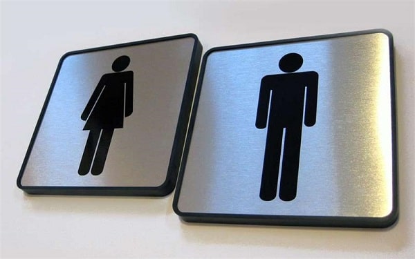 A man and woman bathroom sign