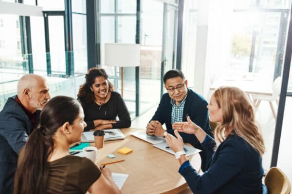 professionals having a meeting at a round table
