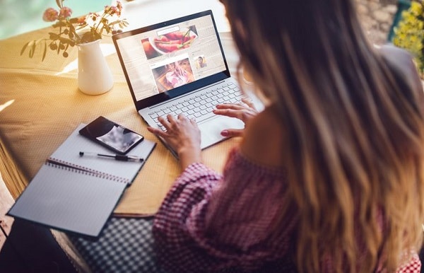 A woman using her laptop to work