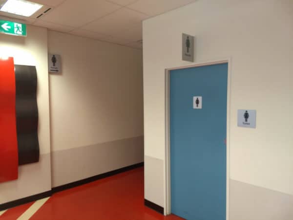 Male restroom along the hallway